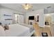 Main bedroom with king bed, walk-in closet, and barn door leading to the bathroom at 2950 Sonata Ct, Saint Cloud, FL 34772