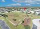 Aerial view of a neighborhood park with a playground and open green space at 2950 Sonata Ct, Saint Cloud, FL 34772