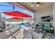 Relaxing screened-in pool area with lounge chairs and umbrellas at 2950 Sonata Ct, Saint Cloud, FL 34772