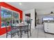 Cozy dining area with glass table and chairs, overlooking the pool at 2988 Stillwater Dr, Kissimmee, FL 34743