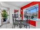 Bright dining area with glass table and chairs, overlooking the pool at 2988 Stillwater Dr, Kissimmee, FL 34743