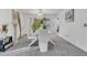 Modern dining room with white table and chairs near sliding doors to the pool at 2988 Stillwater Dr, Kissimmee, FL 34743