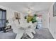 Bright dining room with white table and chairs, view of the pool at 2988 Stillwater Dr, Kissimmee, FL 34743