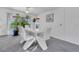 Modern dining room with white table and chairs, access to backyard at 2988 Stillwater Dr, Kissimmee, FL 34743