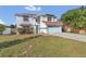 Two-story house with a red tile roof, attached garage, and well-manicured lawn at 2988 Stillwater Dr, Kissimmee, FL 34743