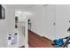 Upstairs hallway with hardwood floors and white doors at 2988 Stillwater Dr, Kissimmee, FL 34743