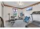 Home gym with treadmill, weight bench, and other exercise equipment at 2988 Stillwater Dr, Kissimmee, FL 34743