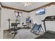 Home gym with treadmill, weight bench, and other exercise equipment at 2988 Stillwater Dr, Kissimmee, FL 34743