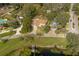 Aerial view of a single story home with a large backyard and lake access at 332 Lake Winnemissett Dr, Deland, FL 32724