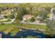 Aerial view of house near lake, lush trees at 332 Lake Winnemissett Dr, Deland, FL 32724