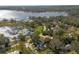 Aerial view of lakefront property, showcasing the home's location and neighborhood at 332 Lake Winnemissett Dr, Deland, FL 32724