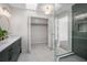 Spa-like bathroom with a walk-in shower and marble floors at 332 Lake Winnemissett Dr, Deland, FL 32724