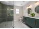 Elegant bathroom with a walk-in shower and double vanity at 332 Lake Winnemissett Dr, Deland, FL 32724