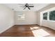 Bright bedroom with hardwood floors and ample natural light at 332 Lake Winnemissett Dr, Deland, FL 32724