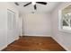 Bright bedroom with wood floors and a large closet at 332 Lake Winnemissett Dr, Deland, FL 32724