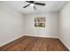 Spacious bedroom featuring wood floors and a window at 332 Lake Winnemissett Dr, Deland, FL 32724