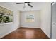 Well-lit bedroom with hardwood floors and window at 332 Lake Winnemissett Dr, Deland, FL 32724