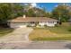 Charming single-story home with a newly paved driveway at 332 Lake Winnemissett Dr, Deland, FL 32724