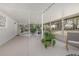 Large screened porch with ample space for plants at 332 Lake Winnemissett Dr, Deland, FL 32724