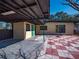 Back exterior view with green door and checkerboard patio at 332 N Lakeland Ave, Orlando, FL 32805