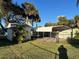 Large backyard with shed, carport, and fenced area at 335 Brookline Ave, Daytona Beach, FL 32118