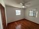 Bedroom with hardwood floors, ceiling fan and two windows at 335 Brookline Ave, Daytona Beach, FL 32118