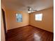 Simple bedroom with hardwood floors and ample natural light at 335 Brookline Ave, Daytona Beach, FL 32118