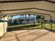 Covered carport offering parking and backyard views at 335 Brookline Ave, Daytona Beach, FL 32118