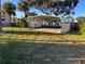 Carport with concrete slab and grassy area at 335 Brookline Ave, Daytona Beach, FL 32118