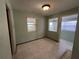 Small dining area with tiled floors and access to a sunroom at 335 Brookline Ave, Daytona Beach, FL 32118