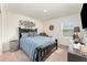 Comfortable bedroom with a double bed and a relaxing armchair at 3444 Bellissimo Ave, Kissimmee, FL 34746