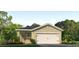 One-story house with a two-car garage and landscaping at 3472 Sandalwood Isle Way, Ocoee, FL 34761