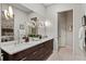 Double vanity bathroom with a view of the bedroom and plenty of counter space at 3513 Pinetree Rd, Orlando, FL 32804