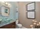 Powder room with glass tile and a unique sink at 3513 Pinetree Rd, Orlando, FL 32804