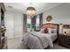 Bright bedroom with a floral headboard and a large window at 3513 Pinetree Rd, Orlando, FL 32804