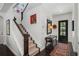 Bright entryway with hardwood floors, staircase, and art at 3513 Pinetree Rd, Orlando, FL 32804