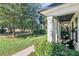 Front porch with wicker chairs and access to a park-like setting at 3513 Pinetree Rd, Orlando, FL 32804