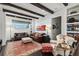 Relaxing living room with exposed beams, leather sofas, and built-in shelving at 3513 Pinetree Rd, Orlando, FL 32804