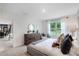 Main bedroom with king-size bed, dresser, and view into the dining area at 3522 Sandalwood Isle Way, Ocoee, FL 34761