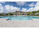 Resort-style community pool with a covered seating area at 3522 Sandalwood Isle Way, Ocoee, FL 34761