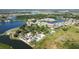 Aerial view showing community lake and homes at 3564 Landing Net Dr, Kissimmee, FL 34746