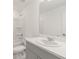 Bathroom features a single vanity, shower/tub combo and gray cabinets at 3564 Landing Net Dr, Kissimmee, FL 34746