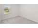 Bright bedroom with carpet flooring and a window offering a view of the yard at 3564 Landing Net Dr, Kissimmee, FL 34746