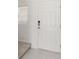 Modern white door and neutral tile floor at 3564 Landing Net Dr, Kissimmee, FL 34746