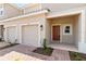 Front entrance with a reddish-brown door at 3564 Landing Net Dr, Kissimmee, FL 34746