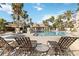 Resort-style pool with lounge chairs and palm trees at 3564 Landing Net Dr, Kissimmee, FL 34746