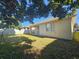 View of the home's backyard, showcasing a patio and grassy area at 5119 Santa Ana Dr, Orlando, FL 32837