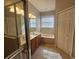 Relaxing bathroom with soaking tub and double sinks at 5119 Santa Ana Dr, Orlando, FL 32837