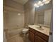 Clean bathroom with tub, toilet, and vanity at 5119 Santa Ana Dr, Orlando, FL 32837