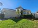 One-story house with palm trees and walkway at 5119 Santa Ana Dr, Orlando, FL 32837